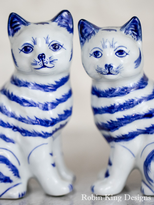 A Pair of Blue and White Vintage Cat Statues